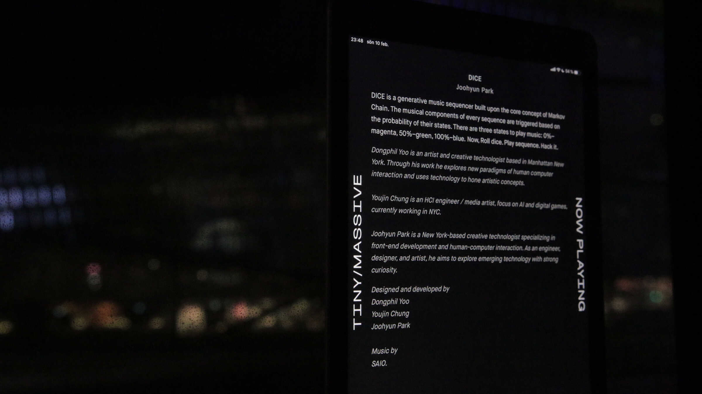 Now Playing tablet display crediting the Dice installation, with the project description, the Markov chain color states, and bios for Dongphil Yoo, Youjin Chung, and Joohyun Park